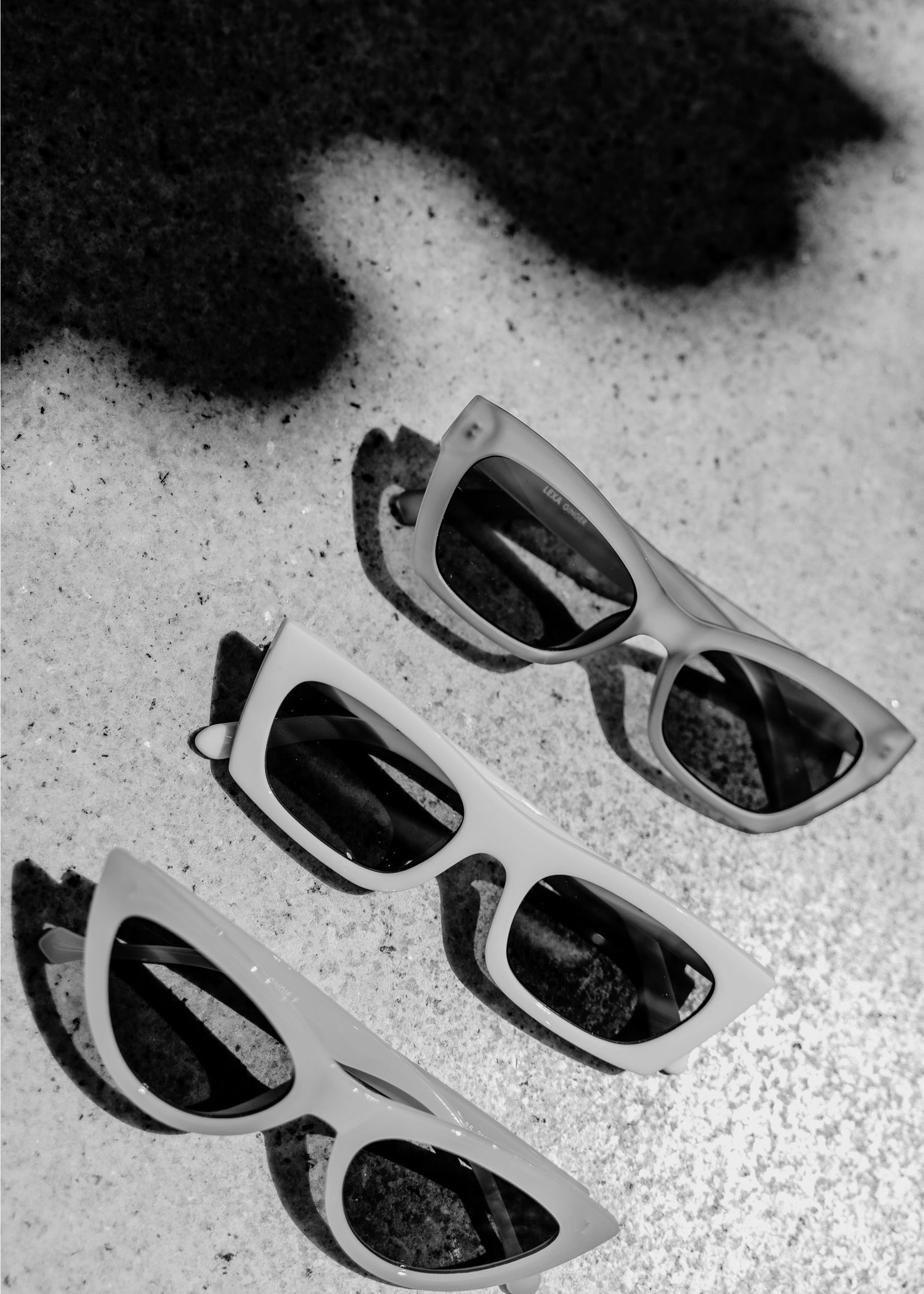 Black-and-white image of trendy sunglasses, representing how brands benefit from the services of a trademark attorney.